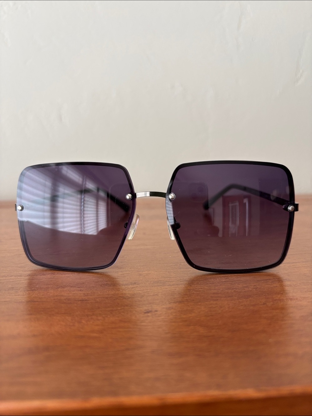 Lucky Brand D2001 women's sunglasses feature a large, square, front-mount metal